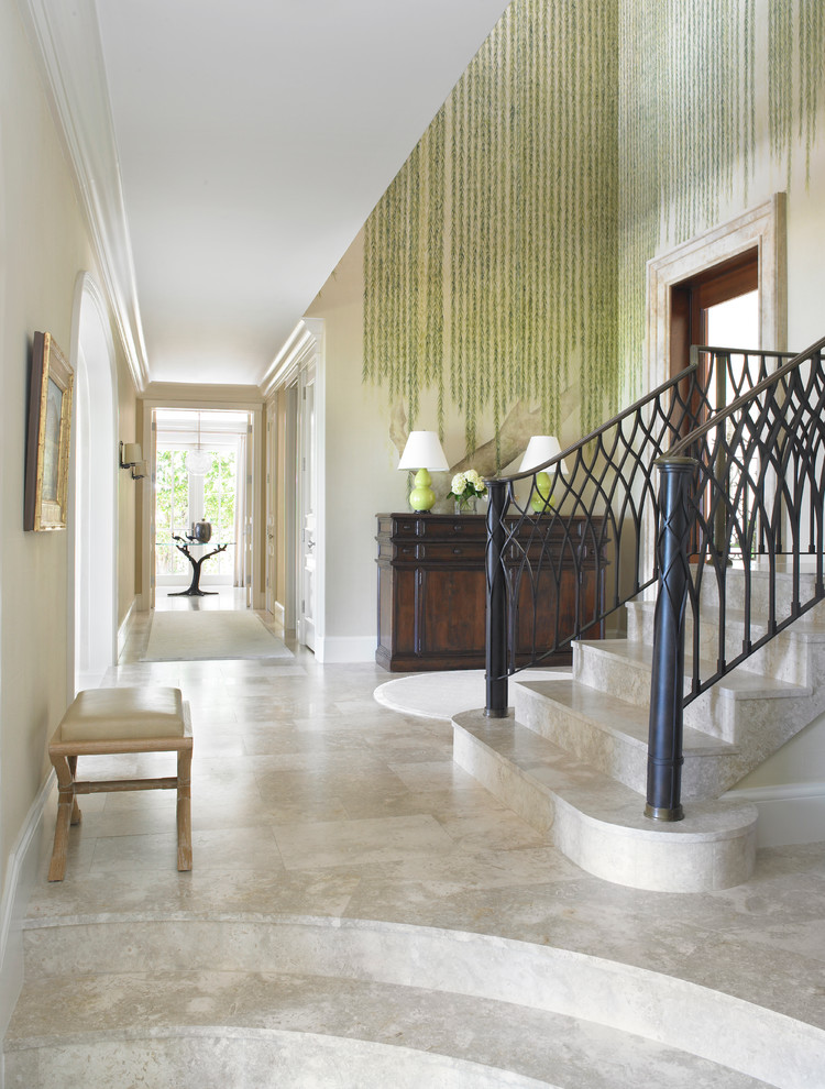 Inspiration for a large mediterranean foyer in Miami with multi-coloured walls, porcelain floors and white floor.