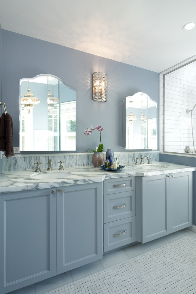 Design ideas for a large beach style master bathroom in Los Angeles with an undermount sink, a corner shower, blue walls, marble floors, marble benchtops, recessed-panel cabinets, grey cabinets, an undermount tub, white tile and subway tile.