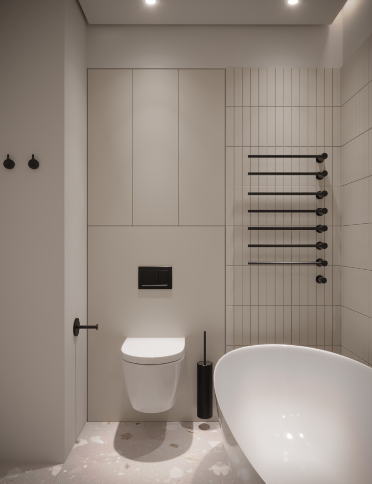 Small scandinavian master bathroom in Palma de Mallorca with raised-panel cabinets, dark wood cabinets, a freestanding tub, a wall-mount toilet, beige tile, ceramic tile, beige walls, cement tiles, an undermount sink, beige floor, a single vanity and a floating vanity.