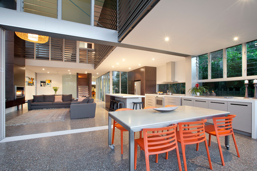 Inspiration for a large contemporary backyard patio in Gold Coast - Tweed with an outdoor kitchen.