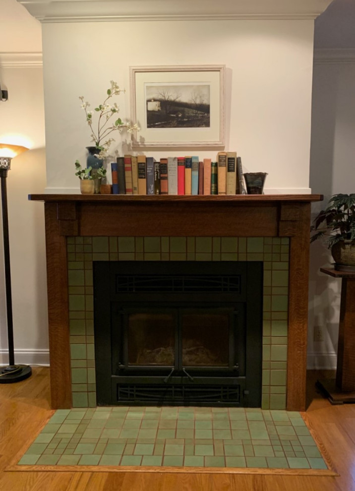 Photo of a mid-sized arts and crafts enclosed living room in Other with yellow walls, medium hardwood floors, a standard fireplace, a tile fireplace surround and green floor.