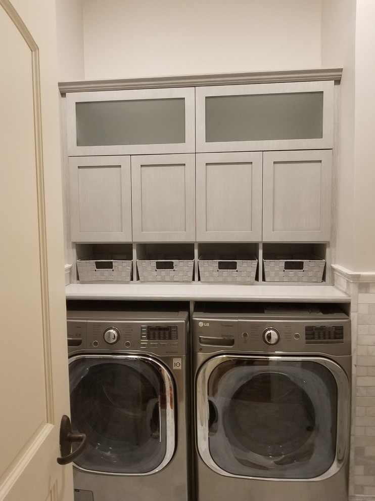 Photo of a small contemporary l-shaped utility room in Providence with an undermount sink, shaker cabinets, turquoise cabinets, granite benchtops, grey walls, marble floors, a side-by-side washer and dryer, white floor and grey benchtop.
