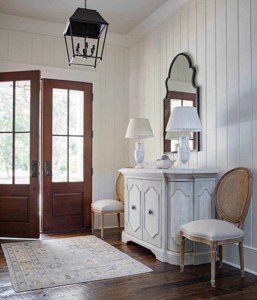 Inspiration for a coastal dark wood floor and brown floor foyer remodel in Atlanta with white walls and a dark wood front door