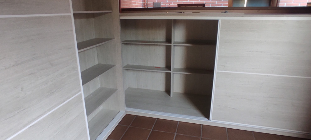 Built-in closet - contemporary wood ceiling built-in closet idea in Other with light wood cabinets