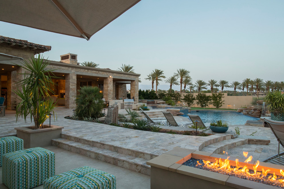 Pool fountain - mid-sized transitional backyard concrete paver and round natural pool fountain idea