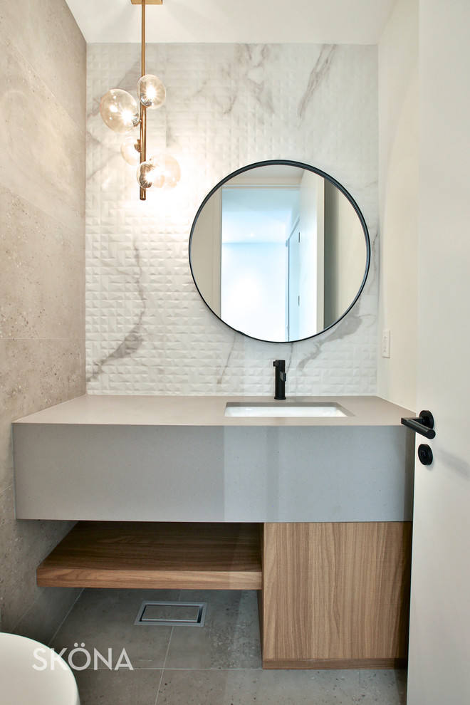Photo of a small contemporary master bathroom in Toronto with white tile, marble, an undermount sink, engineered quartz benchtops and grey benchtops.
