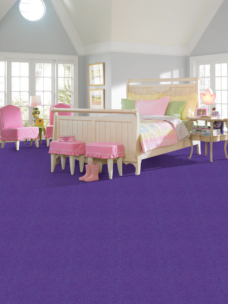 Photo of a mid-sized contemporary kids' bedroom for kids 4-10 years old and girls in New York with beige walls and carpet.