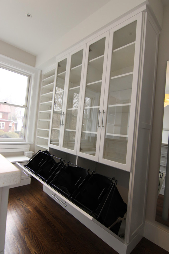 Mid-sized transitional home design photo in Los Angeles with glass-front cabinets and white cabinets