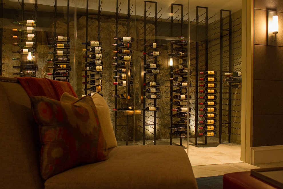 Photo of a large modern wine cellar in Vancouver with storage racks, porcelain floors and beige floor.