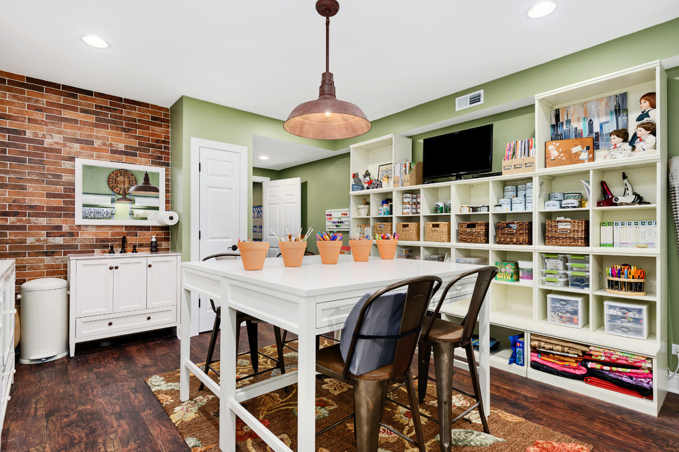 Design ideas for a country craft room in Chicago with green walls, dark hardwood floors and a freestanding desk.