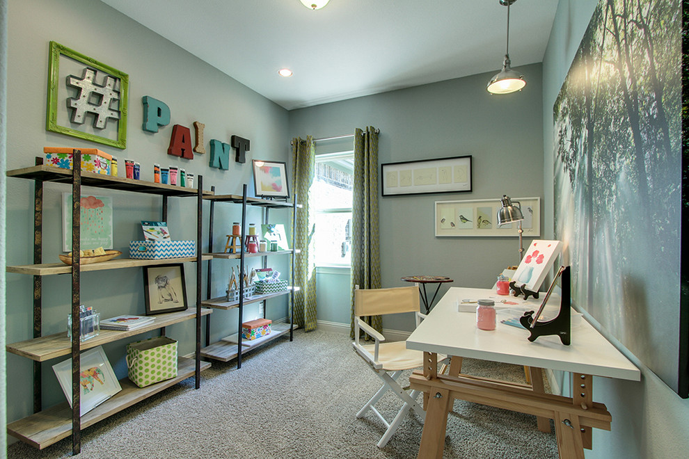 This is an example of a mid-sized traditional craft room in Dallas with grey walls, carpet, no fireplace and a freestanding desk.