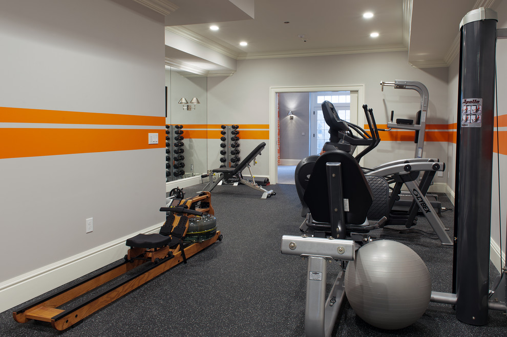 This is an example of a mid-sized transitional home weight room in New York with orange walls and grey floor.