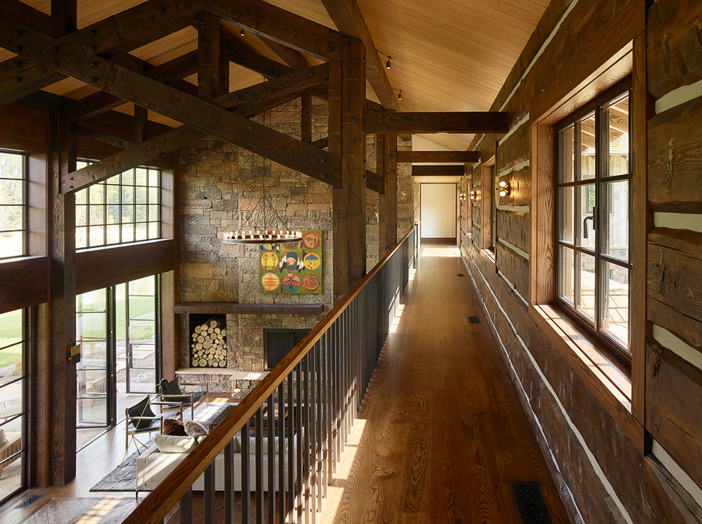 Country hallway in Other with medium hardwood floors.
