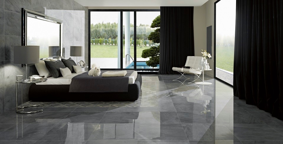 Inspiration for a mid-sized scandinavian master bedroom in Stuttgart with grey walls, ceramic floors and grey floor.