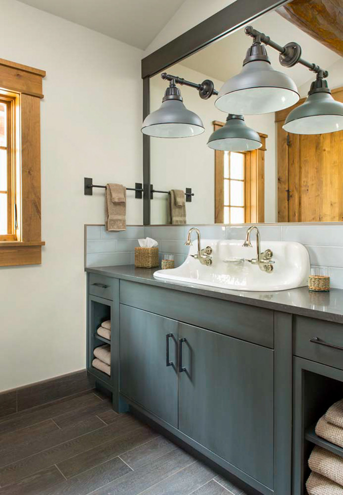 Country bathroom in Denver with flat-panel cabinets, grey cabinets, white walls, dark hardwood floors and a trough sink.