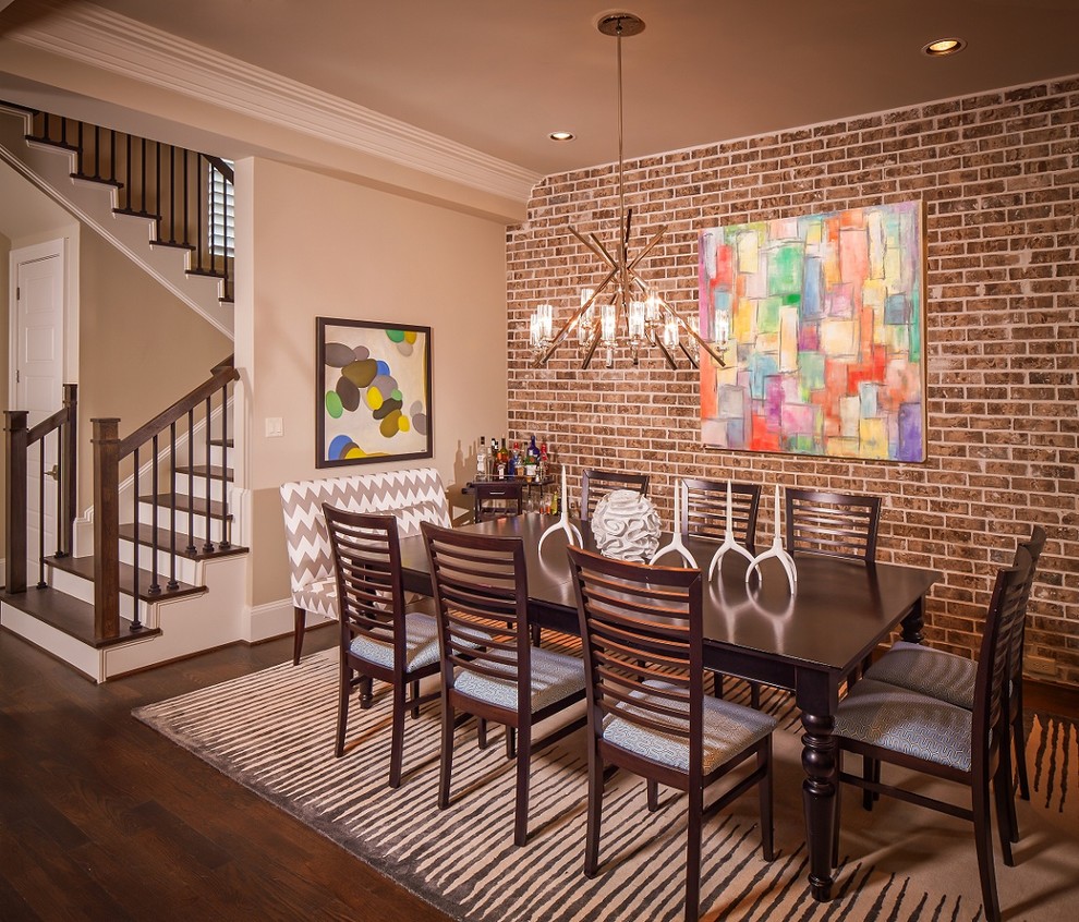 Photo of a contemporary dining room in Houston with beige walls and dark hardwood floors.