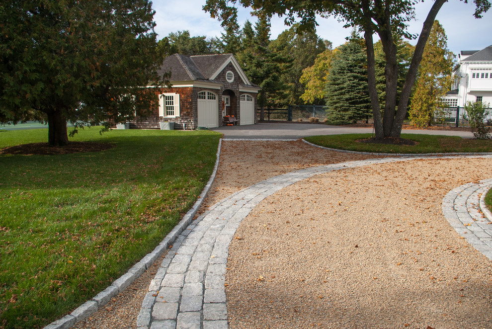 Inspiration for a large beach style front yard full sun driveway in Boston with gravel.