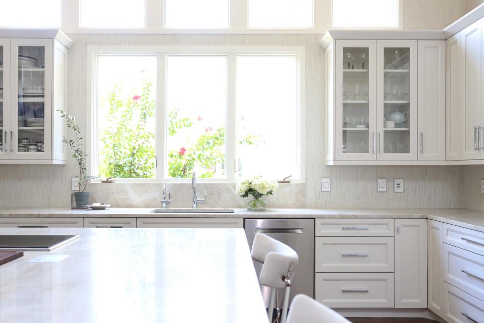 Eat-in kitchen - huge transitional medium tone wood floor and brown floor eat-in kitchen idea with an undermount sink, recessed-panel cabinets, white cabinets, quartzite countertops, white backsplash, ceramic backsplash, stainless steel appliances, an island and white countertops