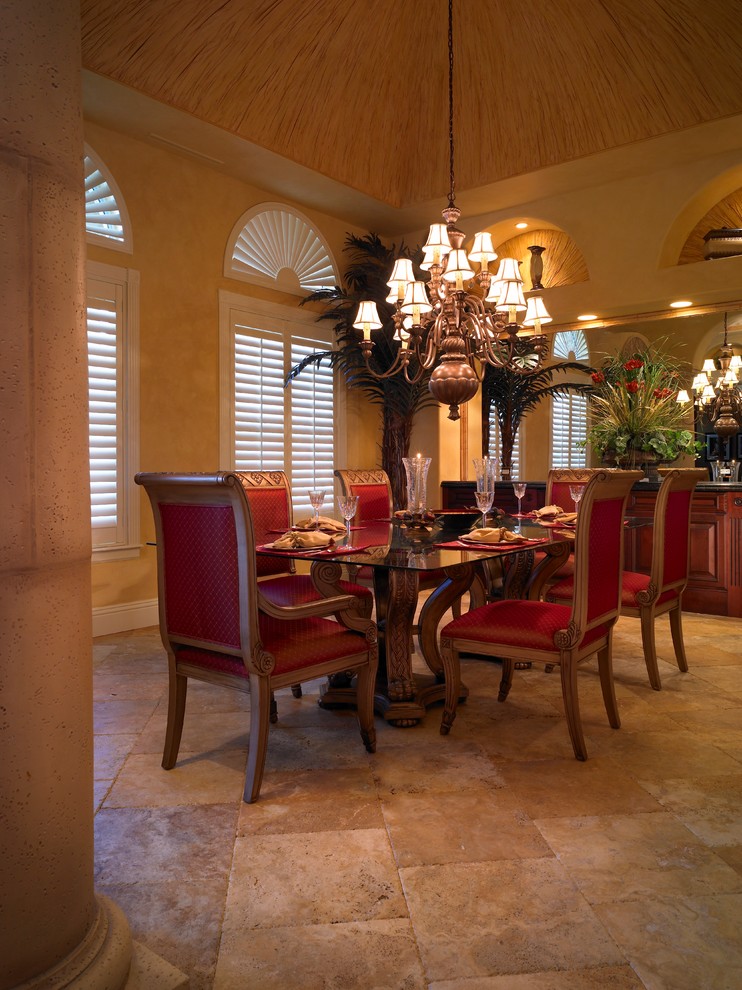 Inspiration for a mediterranean dining room in Miami with marble floors.