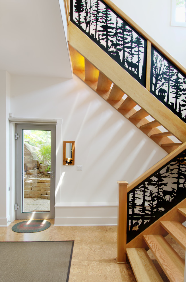 Design ideas for a country wood u-shaped staircase in Ottawa with open risers.