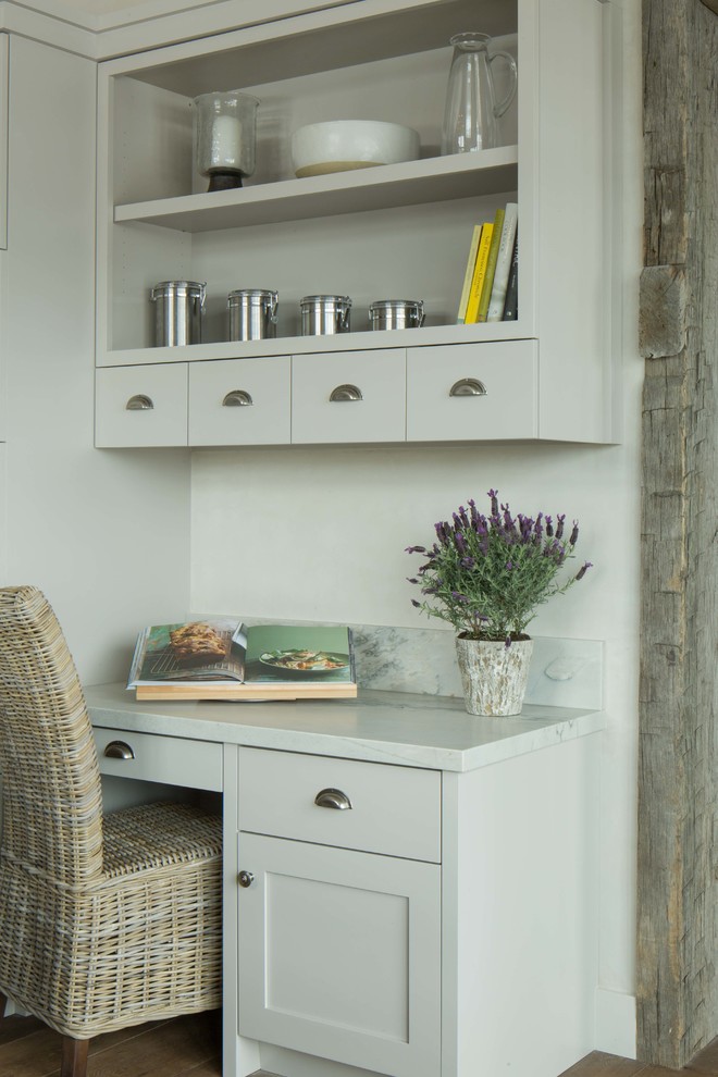 Example of a mountain style kitchen design with gray cabinets and marble countertops