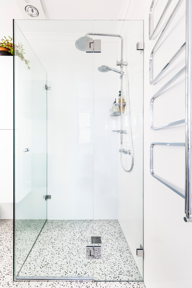 Small contemporary 3/4 bathroom in Sydney with furniture-like cabinets, white cabinets, a drop-in tub, a corner shower, a wall-mount toilet, white tile, porcelain tile, white walls, porcelain floors, a vessel sink, engineered quartz benchtops, multi-coloured floor, an open shower and grey benchtops.