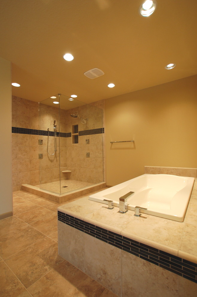 Design ideas for a large modern master bathroom in Boise with an undermount sink, flat-panel cabinets, medium wood cabinets, granite benchtops, a drop-in tub, a corner shower, beige tile, ceramic tile, yellow walls and ceramic floors.