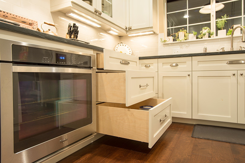 Inspiration for a transitional galley eat-in kitchen remodel in Austin with shaker cabinets and white cabinets