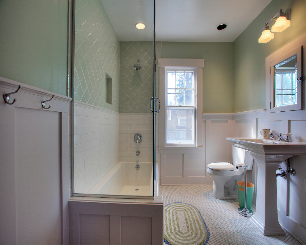 Design ideas for a mid-sized arts and crafts bathroom in Seattle with a pedestal sink, an alcove tub, green tile, ceramic tile, green walls and mosaic tile floors.