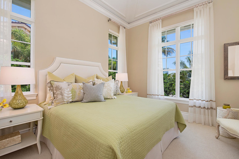 Inspiration for a mid-sized transitional master carpeted and beige floor bedroom remodel in Miami with beige walls and no fireplace