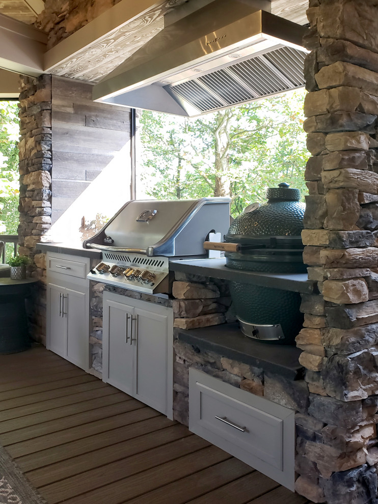 Inspiration for a transitional backyard second story metal railing deck remodel