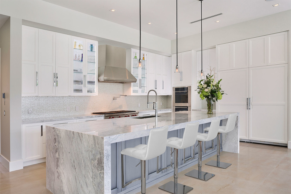 Example of a mid-sized transitional l-shaped ceramic tile and beige floor open concept kitchen design in Miami with an undermount sink, recessed-panel cabinets, white cabinets, marble countertops, multicolored backsplash, mosaic tile backsplash, stainless steel appliances, an island and multicolored countertops