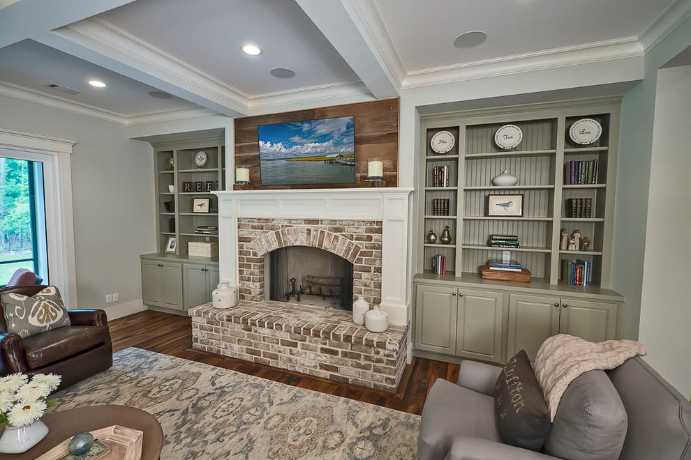 Design ideas for a large transitional formal open concept living room in Atlanta with dark hardwood floors, a standard fireplace, a brick fireplace surround, a wall-mounted tv and grey walls.