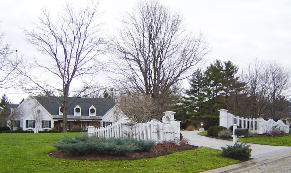 This is an example of a mid-sized transitional full sun front yard landscaping in Cincinnati for spring.