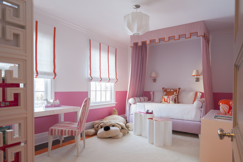 This is an example of a mid-sized transitional kids' bedroom for girls and kids 4-10 years old in Dallas with pink walls, carpet and white floor.
