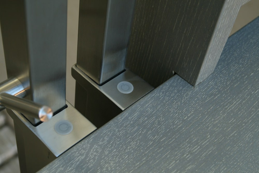 Modern metal stair covered by patina oak