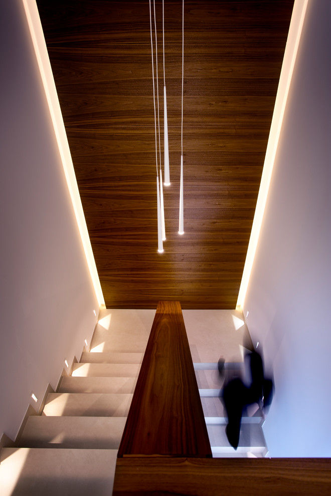 Design ideas for a mid-sized contemporary concrete u-shaped staircase in Other with concrete risers and wood railing.