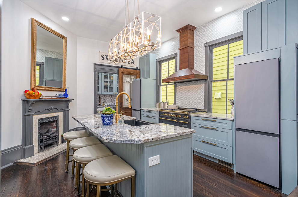 Inspiration for a large transitional galley dark wood floor and black floor eat-in kitchen remodel with a single-bowl sink, shaker cabinets, blue cabinets, granite countertops, blue backsplash, ceramic backsplash, black appliances, an island and white countertops