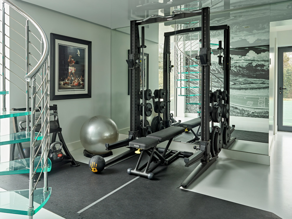 Design ideas for a large contemporary home gym in Hertfordshire with grey walls and grey floor.