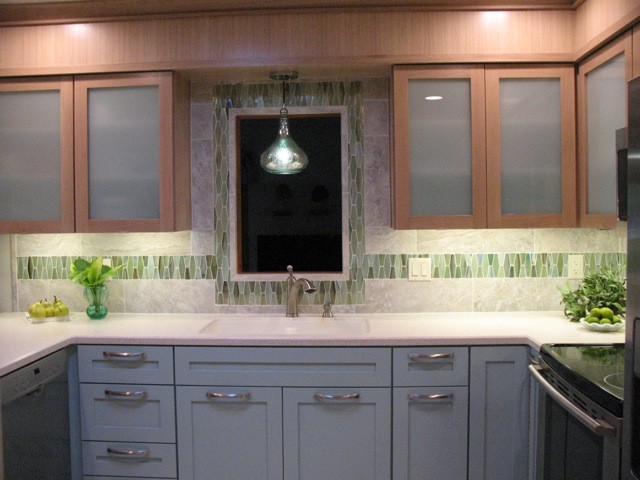 Transitional kitchen photo with green backsplash and mosaic tile backsplash