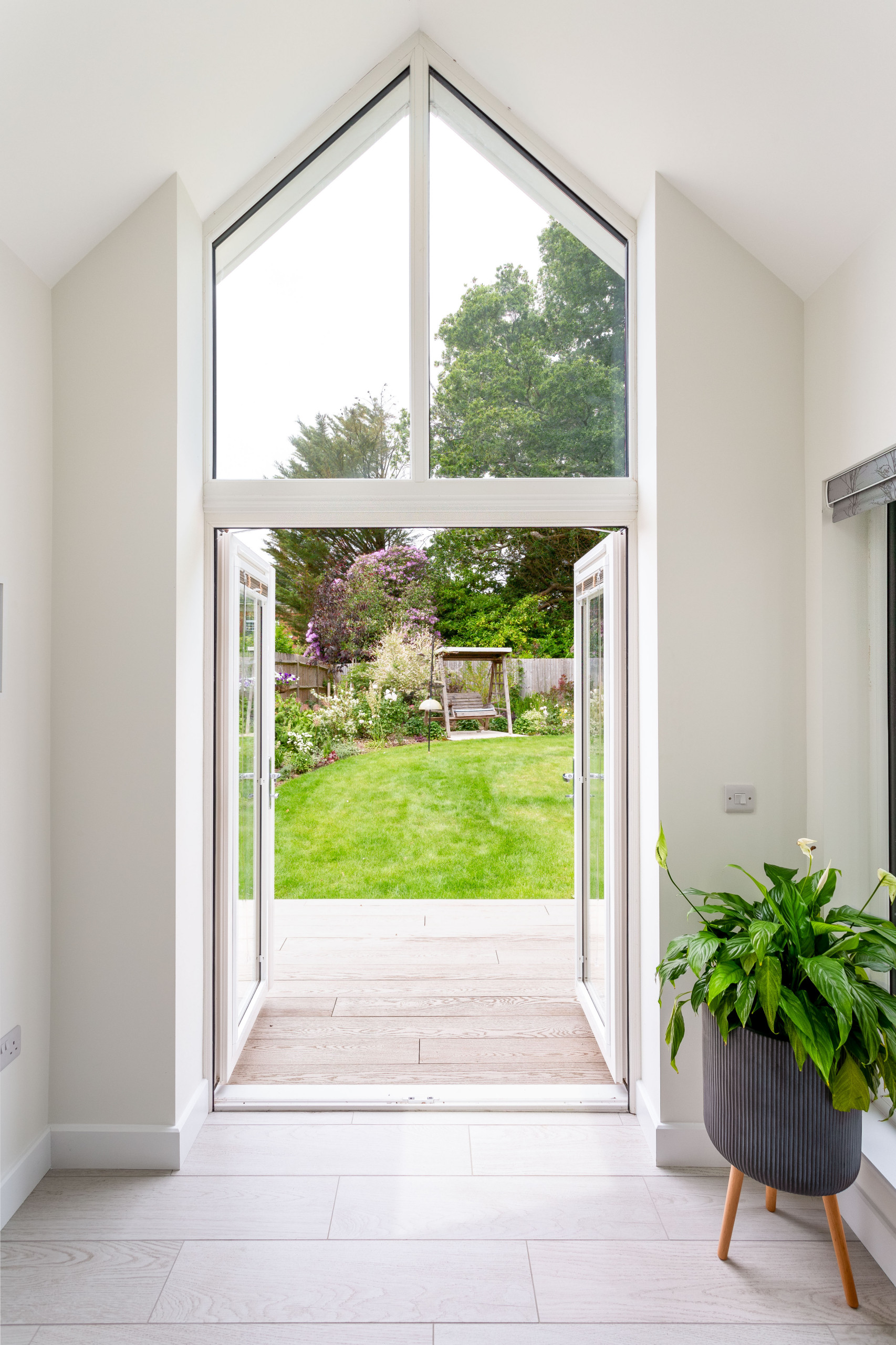View of high-level window and doors out to garden