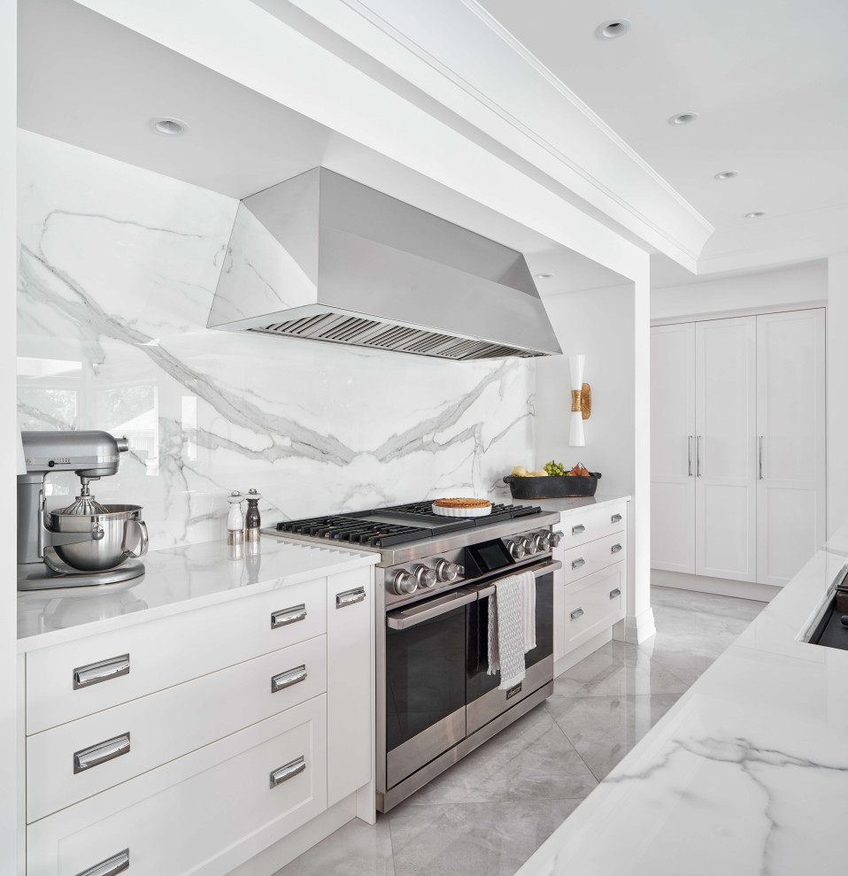 Example of a large trendy l-shaped eat-in kitchen design in Ottawa with two islands