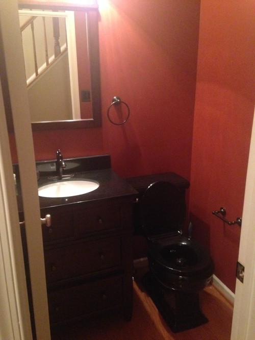 Dark bathroom  with black  toilet help with color decor  ideas 