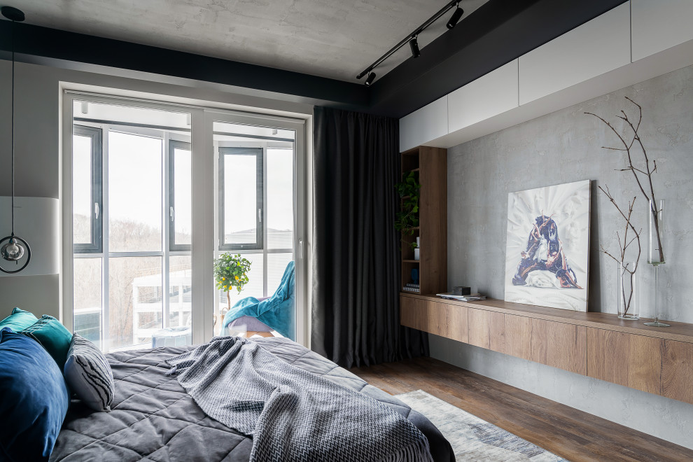 Photo of a medium sized contemporary master and grey and white bedroom in Other with vinyl flooring, brown floors, a drop ceiling, green walls, panelled walls and a feature wall.
