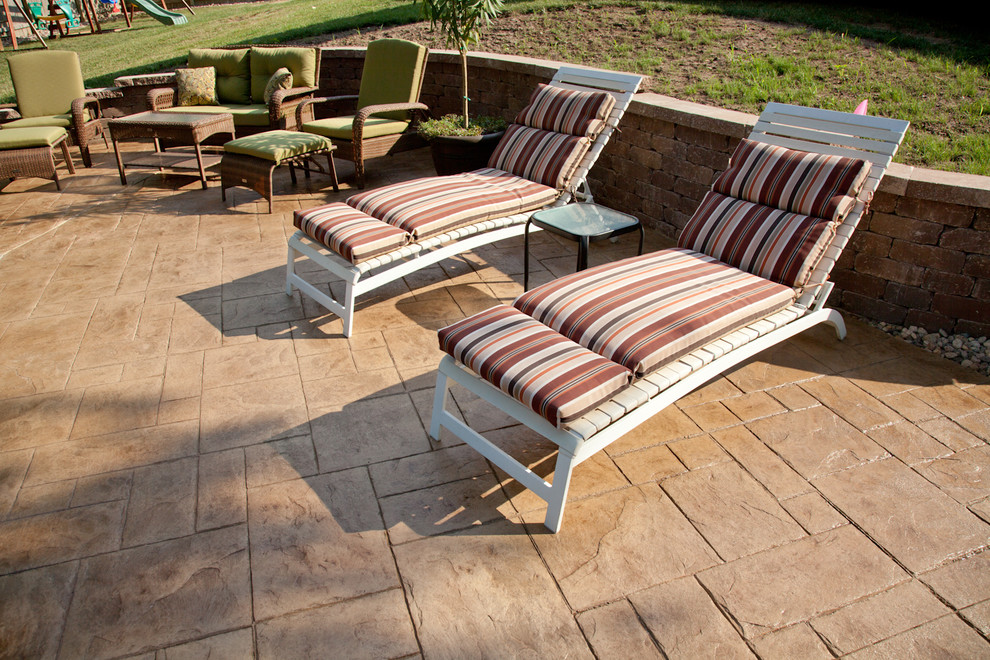 Design ideas for a contemporary patio in Kansas City with stamped concrete.