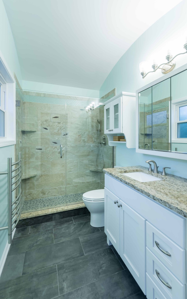 Design ideas for a mid-sized traditional master bathroom in Chicago with beaded inset cabinets, white cabinets, a freestanding tub, an alcove shower, a one-piece toilet, white tile, ceramic tile, yellow walls, ceramic floors, a drop-in sink, quartzite benchtops, white floor, a shower curtain, white benchtops, a single vanity, a freestanding vanity, wallpaper and wallpaper.
