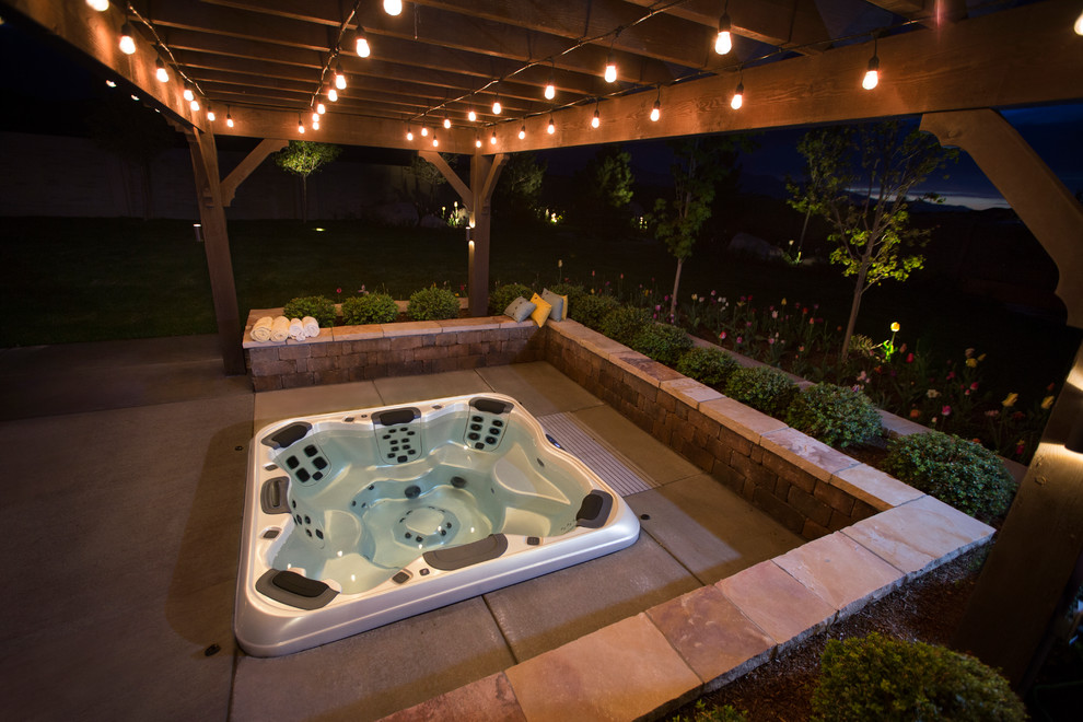 Inspiration for a large transitional backyard rectangular lap pool in Salt Lake City with a hot tub and concrete pavers.