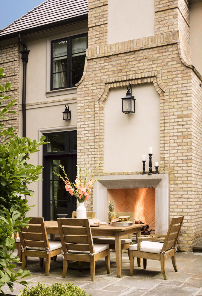 Design ideas for a traditional patio in Milwaukee with no cover and with fireplace.