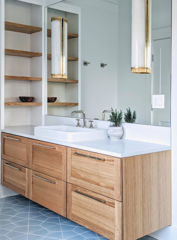 Photo of a mid-sized beach style master bathroom in New York with light wood cabinets, white walls, ceramic floors, blue floor, white benchtops, a single vanity, a floating vanity, shaker cabinets and a wall-mount sink.