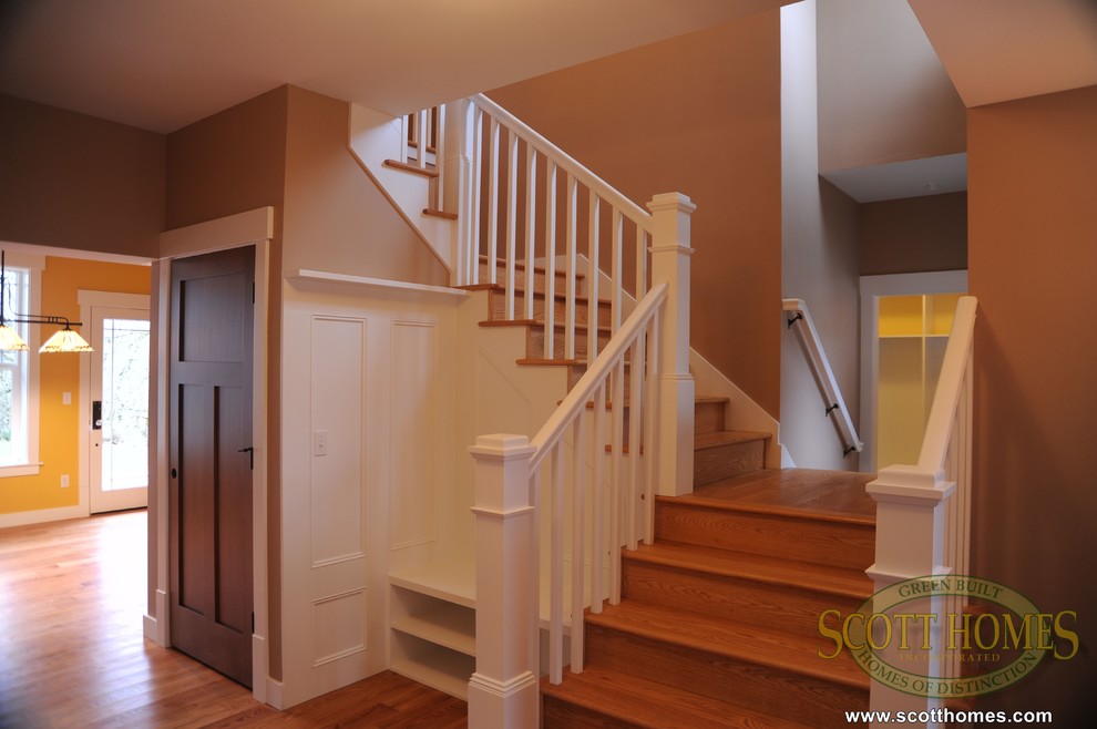 Inspiration for a large arts and crafts foyer in Seattle with beige walls and light hardwood floors.